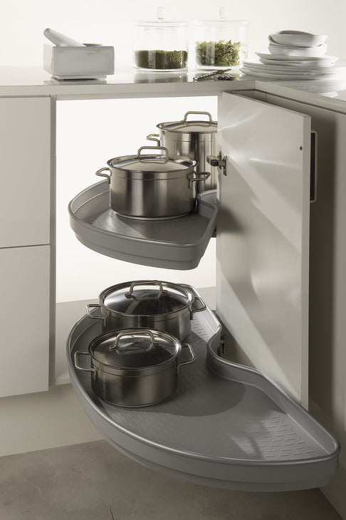 Corner kitchen cabinet with pull-out shelves holding pots and pans.