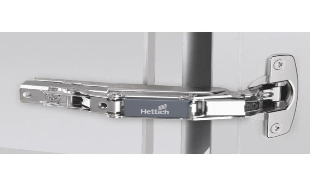 Hettich hinge on a door with a white background