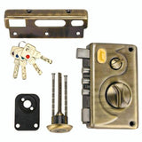 Brass door lock set with keys and tools on a white background