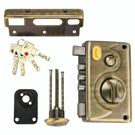 Brass door lock set with keys and tools on a white background
