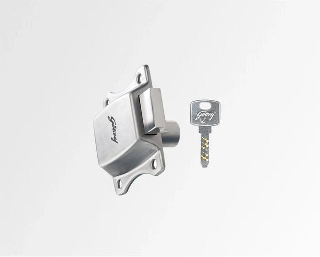 Metallic ignition switch and key on a light gray background
