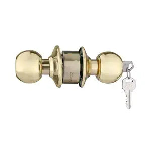 Brass door handle with key on a white background