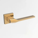 Gold door handle on a white background