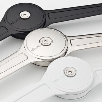 Close-up of three pizza slicers with black, silver, and white handles on a white background.