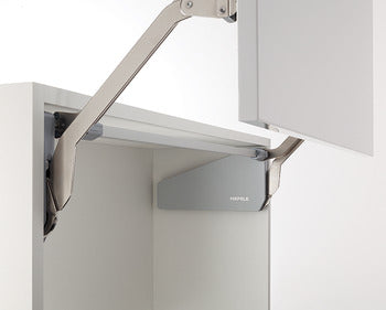 Metallic bracket attached to a white cabinet with 'Hafele' branding.