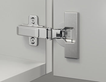 Close-up of a metallic hinge on a glass door