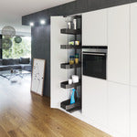 Modern kitchen with white cabinets, black appliances, and a wooden floor.