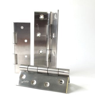 Three metal hinges on a white background