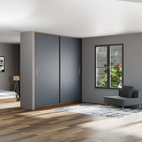 Modern bedroom with gray wardrobe, bed, and window with plants