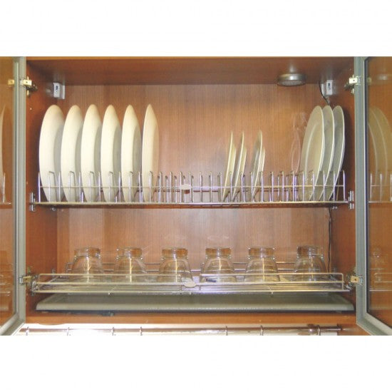 Dishwasher with racks holding plates and glasses inside a wooden cabinet.