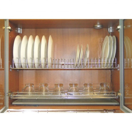 Dishwasher with racks holding plates and glasses inside a wooden cabinet.