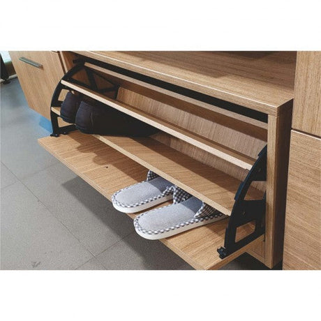 Wooden shoe rack with slippers on a wooden floor