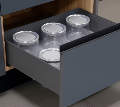 Gray drawer with clear plastic containers and silver lids.