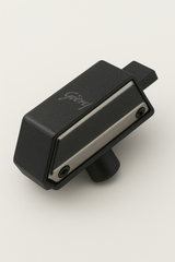 Black and silver guitar pickup on a white background